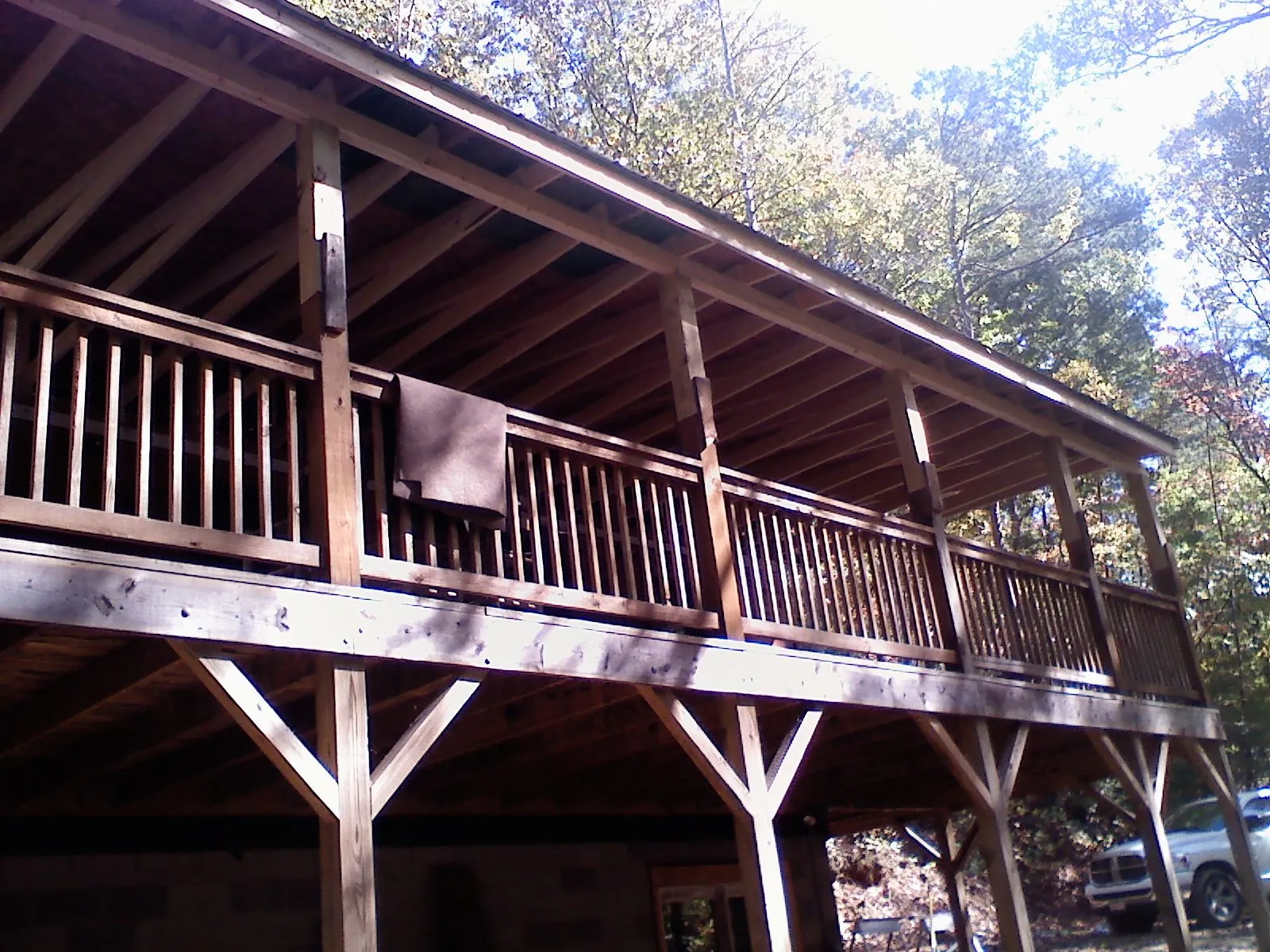 Timber framing under a new elevated porch and deck — Roof Leak Repair in Harvard by Roofing Brothers